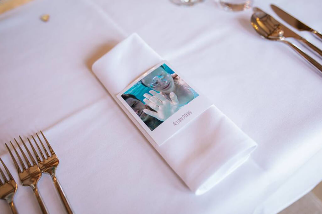 The couple worked hard to find photos of each of their wedding guests as use them for the place names – wedding ideas