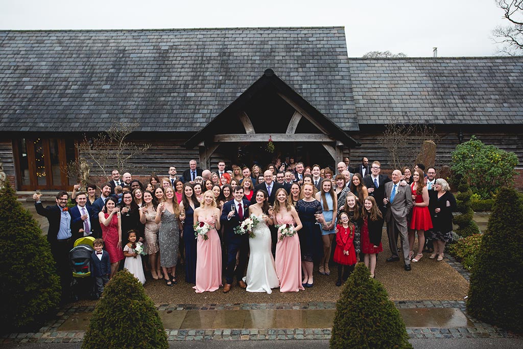 Family gathering outside of sandhole oak barn