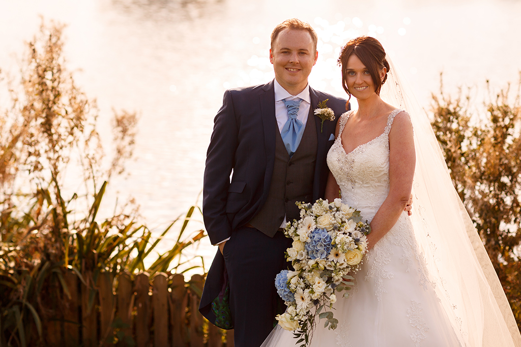 The bride’s bouquet was a beautiful mix of blue and white flowers at this summer wedding at Sandhole Oak Barn