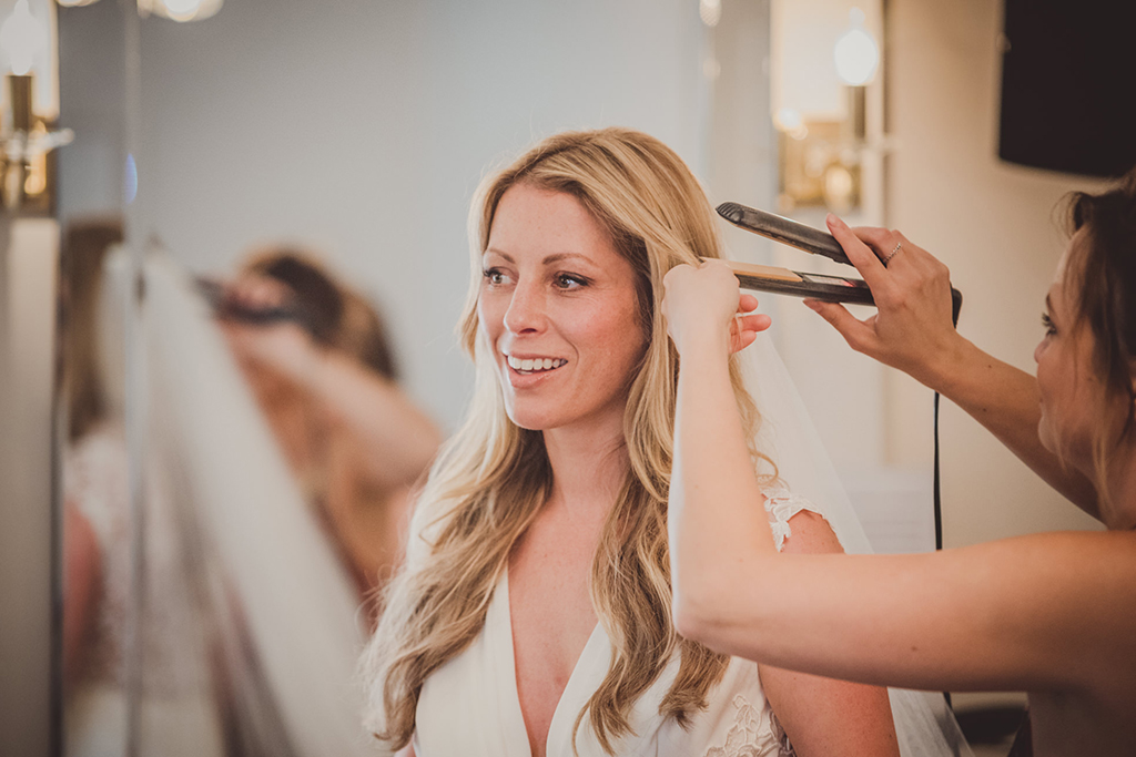 The bride prepares for the wedding ceremony at Sandhole Oak Barn in Cheshire 