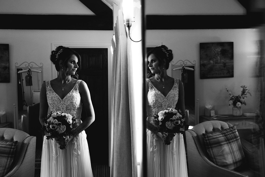 The bride prepares for the day ahead at her wedding at Sandhole Oak Barn