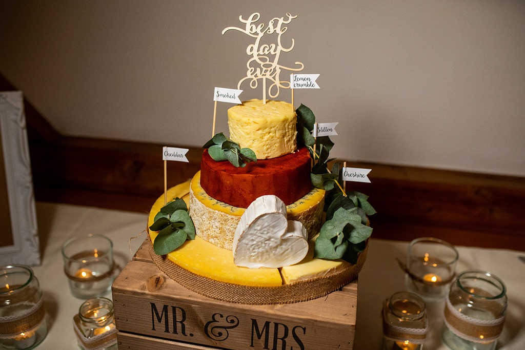 The couple opted for a cheese stack wedding cake for their wedding at Sandhole Oak Barn in Cheshire