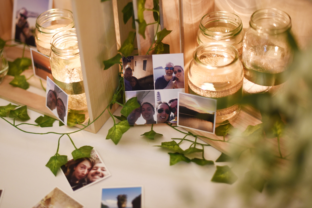 Tables were decorated with jars of tealights and photos of the happy couple at Sandhole Oak Barn