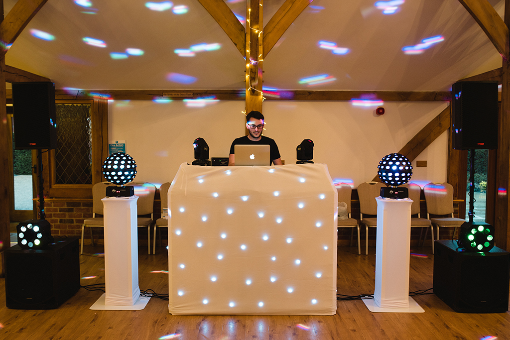 The dj gets ready to entertain the guests at this wedding evening at Sandhole Oak Barn in Cheshire