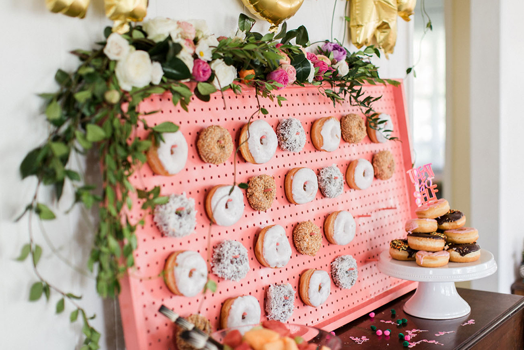 A doughnut wall is a fun alternative to a traditional wedding cake for your Cheshire barn wedding
