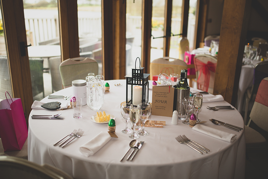 The couple had chosen personalised wooden egg cups filled with chocolate eggs for their Easter wedding at Sandhole Oak Barn