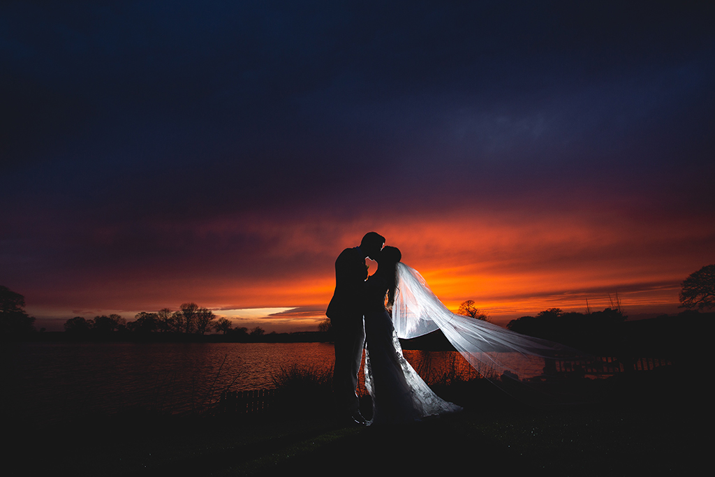 This rural barn wedding venue near Manchester offers the perfect backdrop for dramatic sunset wedding photos