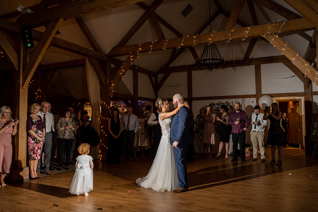 The bride and groom enjoy their first dance at Sandhole Oak Barn 