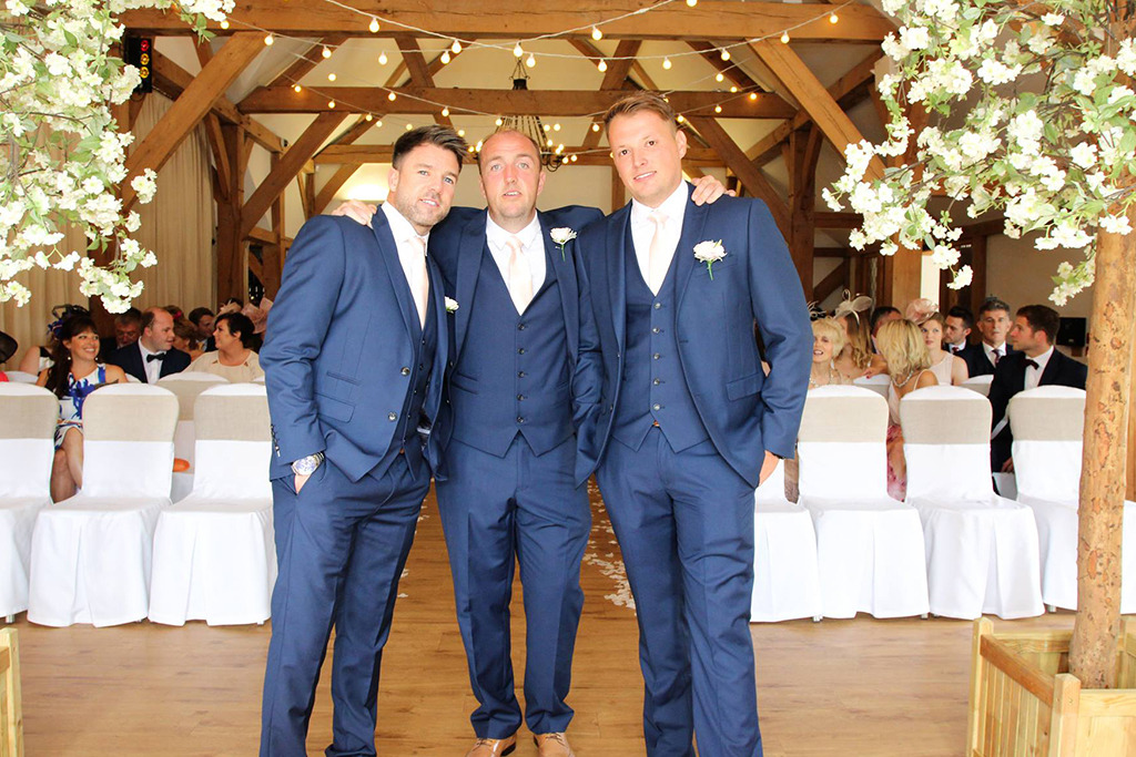 The groom and groomsmen prepare for the wedding ceremony at Sandhole Oak Barn