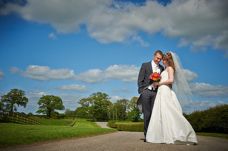 Tracy and Alex in the stunning grounds at Sandhole Oak Barn