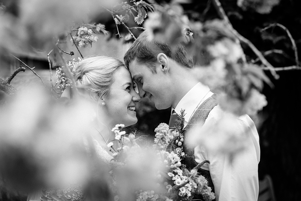 The bride and groom have some beautiful wedding photos taken at this rural wedding venue in Cheshire