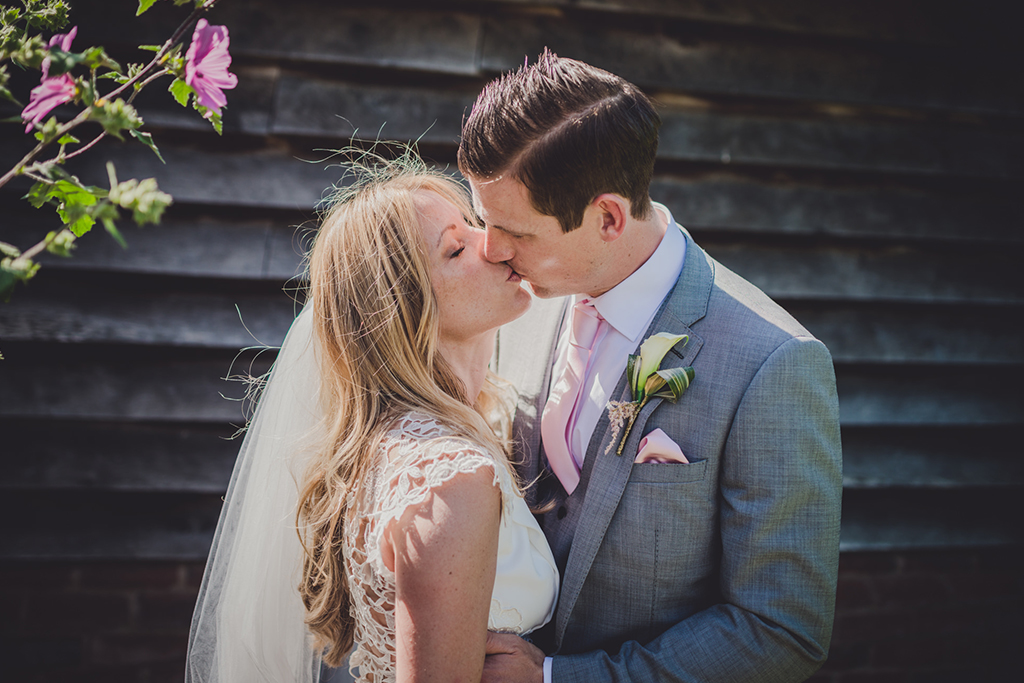 The happy newlyweds share a moment away from the celebrations at their barn wedding in Cheshire