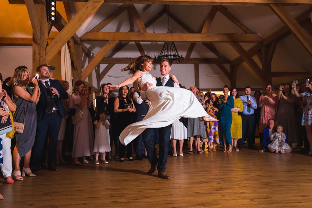 The happy couple take to the dancefloor at their wedding evening at Sandhole Oak Barn