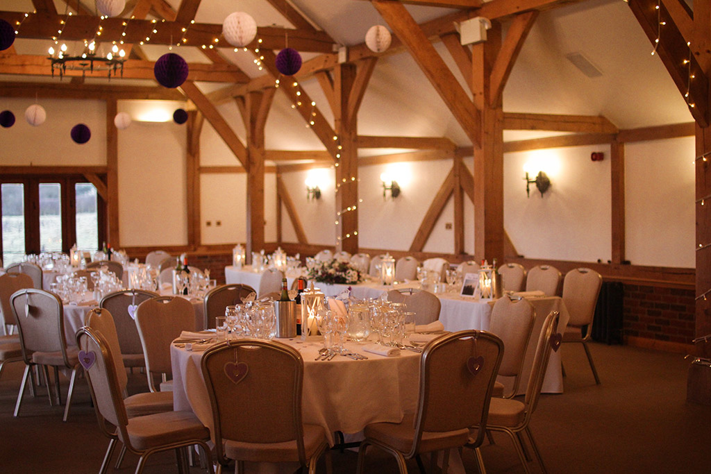 The barn set up for a wedding breakfast at Sandhole Oak Barn