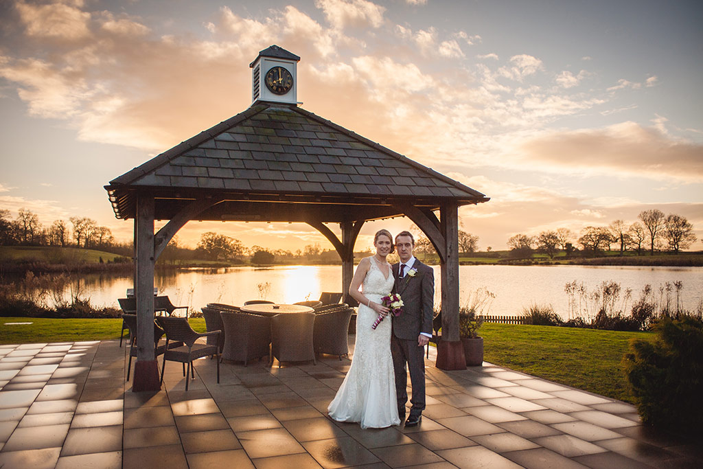 Kirtsy and Richard outside the beautiful Clock Tower at Sandhole Oak Barn