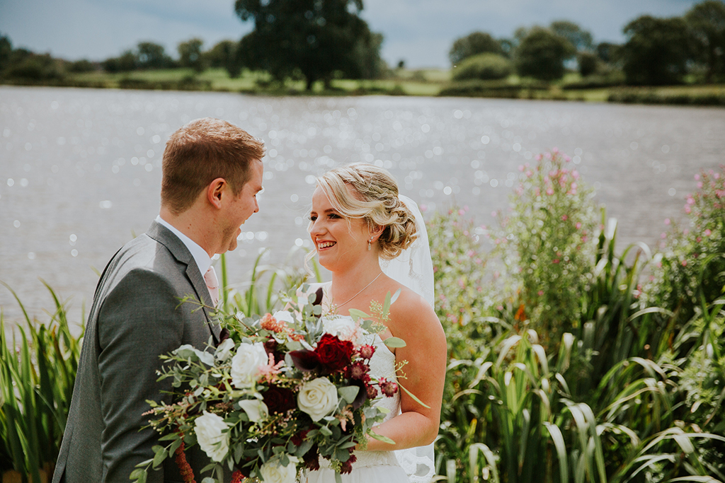 The couple steal a moment away from their wedding party to reflect on their happy wedding day