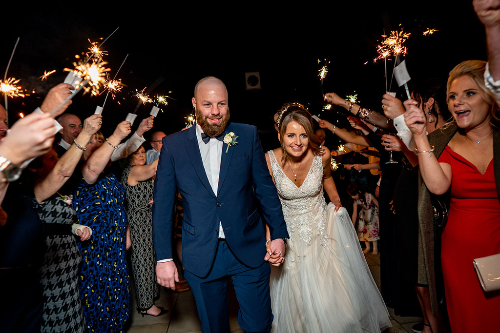 The happy couple enjoyed a sparkler finale at their wedding evening at Sandhole Oak Barn 