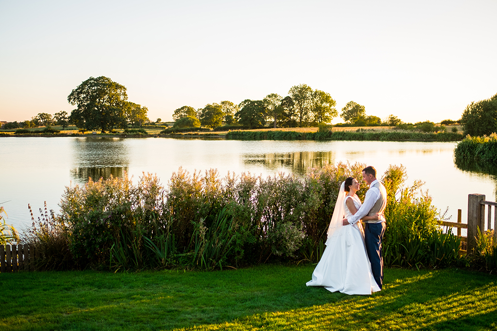 The lakeside is the perfect setting for having romantic wedding photos taken at your barn wedding at Sandhole Oak Barn