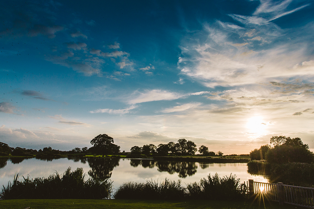 Sandhole Oak Barn with its views over the lake offers lots of opportunities for stunning wedding photos