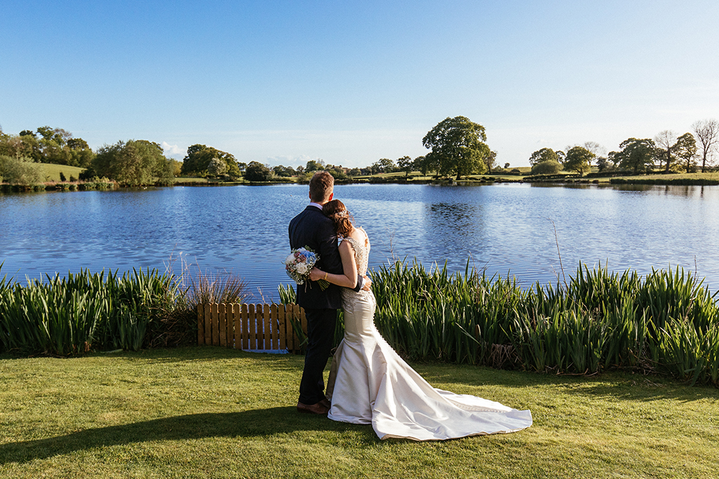 The lake at Sandhole Oak Barns offers the most romantic backdrop for your wedding photos at your barn wedding near Manchester