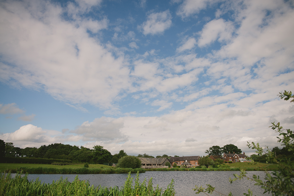 This stunning barn wedding venue lies in a picturesque countryside setting next to a lake