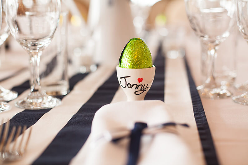 egg cup favours with a chocolate egg place name
