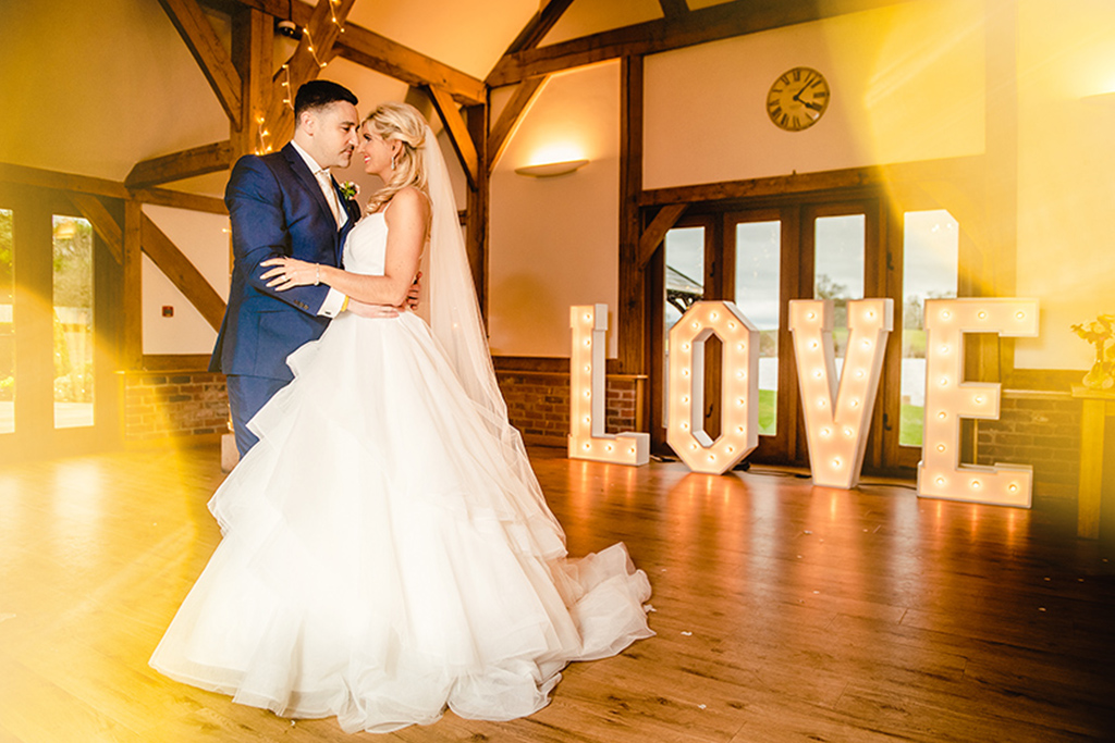 Large light up love letters are perfect for your Valentine barn wedding at Sandhole Oak Barn