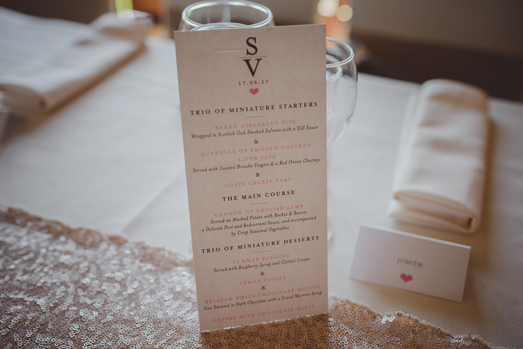 Simply elegant white printed wedding menus were placed at each place setting at this Sandhole Oak Barn wedding 