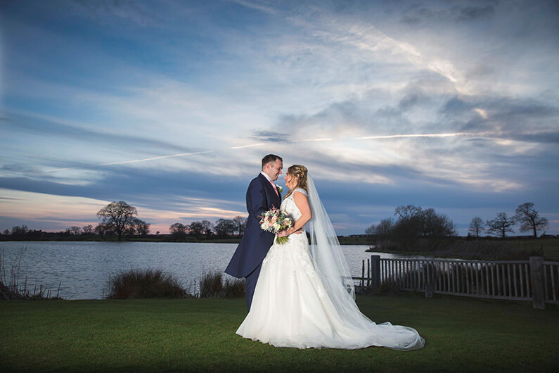Micaela and Garry by the beautiful lake at dusk
