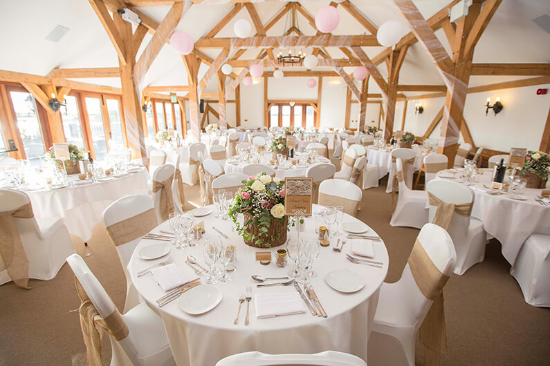 The barn decorated with pink and white flowers