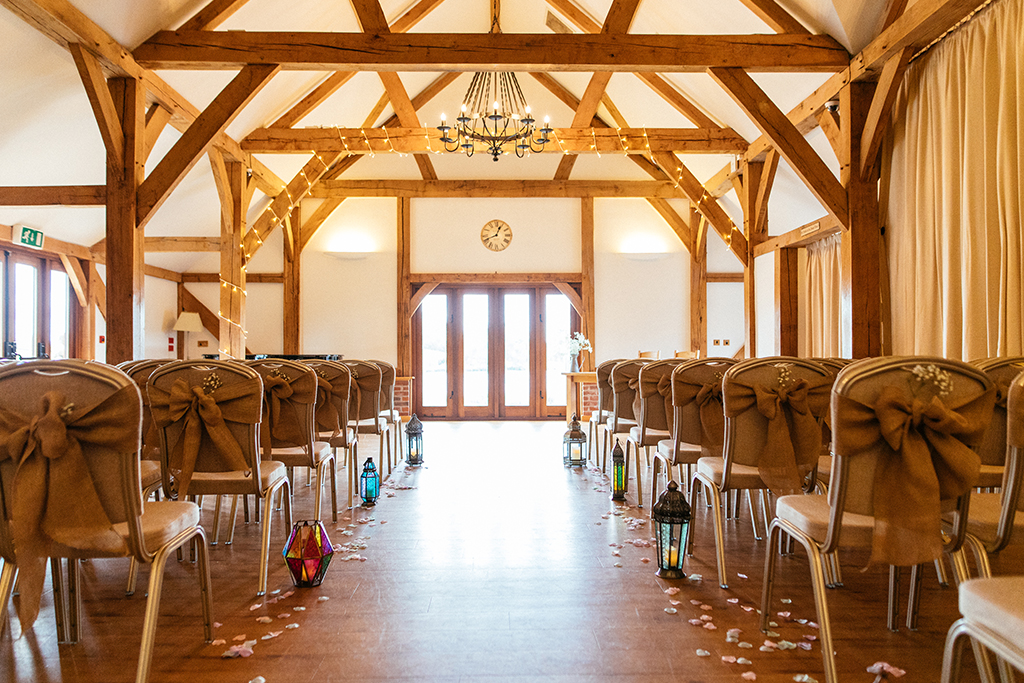 The doors of the Oak Barn open onto the lakeside verandah making it the perfect setting for those balmy wedding days at Sandhole Oak Barn in rural Cheshire