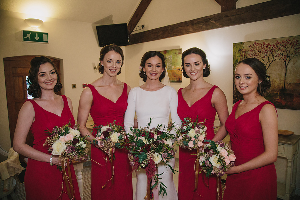 Red bridesmaid dresses are perfect choice for your Valentine wedding at Sandhole Oak Barn in the North West