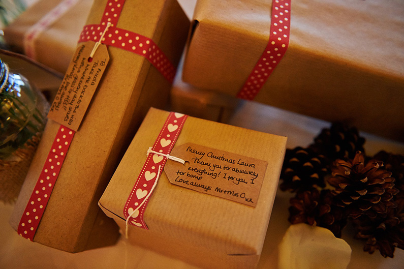 Christmas themed wedding favours with red ribbon