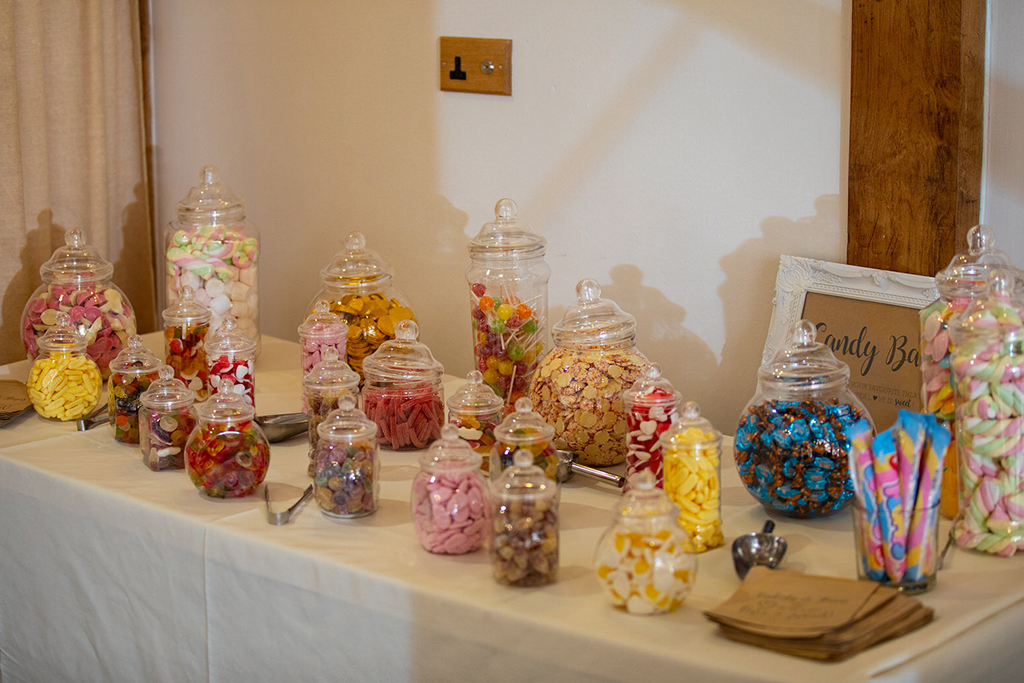 The couple had a sweet table for their wedding guests to enjoy at their barn wedding in Cheshire