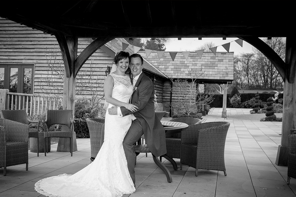 The happy couple take a moment to pose for photos at Sandhole Oak Barn