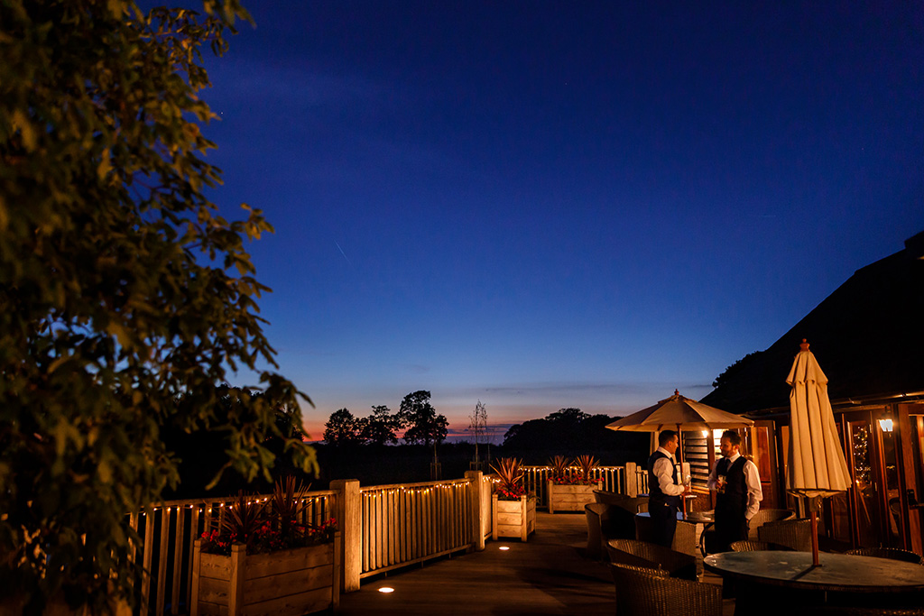 The verandah at Sandhole Oak Barn is the perfect place to watch the sunset on a warm evening in Cheshire
