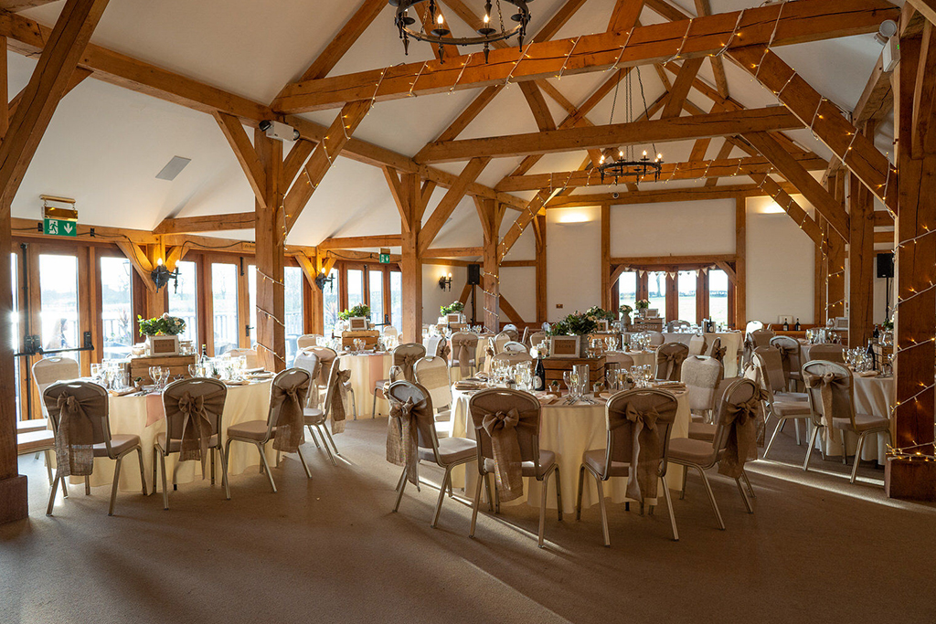 The oak barn was set up for the wedding breakfast at Sandhole Oak Barn in Cheshire