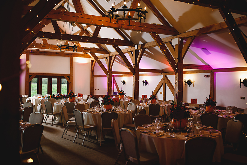 The Oak Barn was lit with pretty fairy lights along the beams and coloured lights lit up the walls