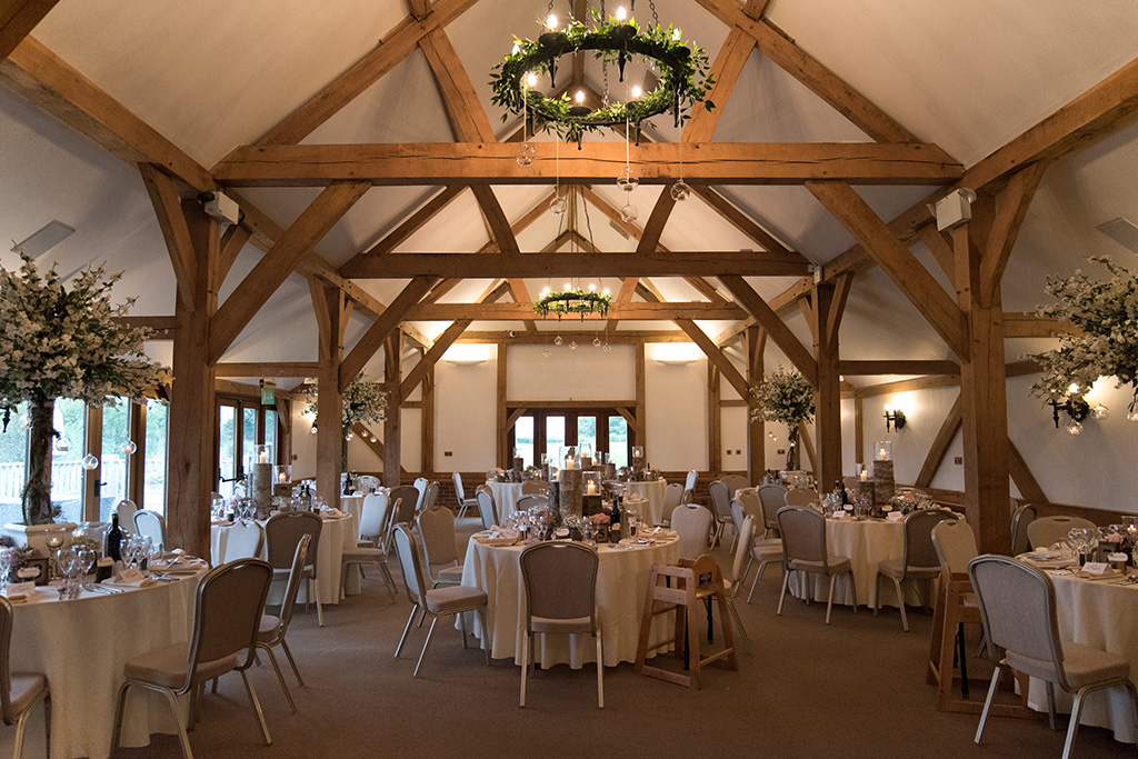 The oak barn is set up for the wedding breakfast at Sandhole Oak Barn in Cheshire