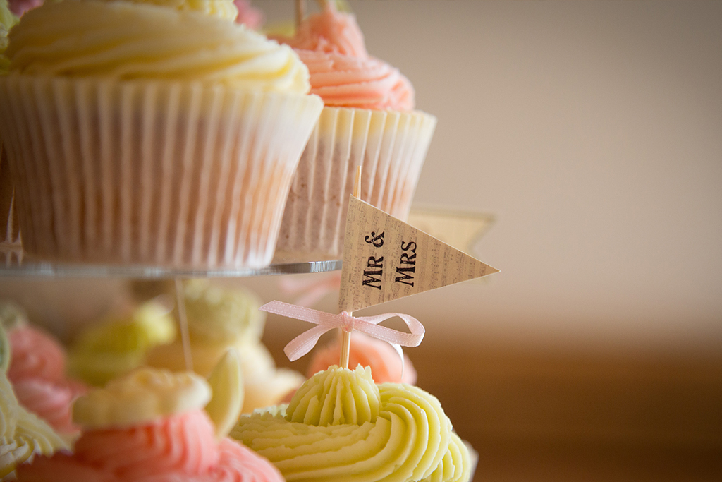 The wedding cake was made up of perfectly pretty pastel iced cupcakes at Sandhole Oak Barn