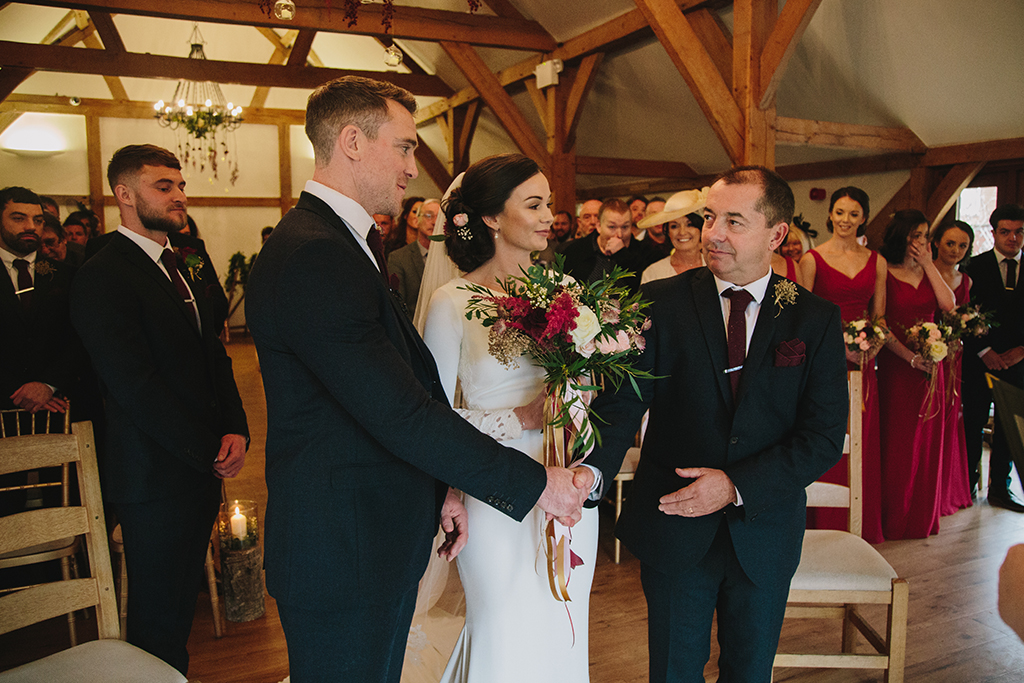 The bride’s father gives his seal of approval at this beautiful barn wedding at Sandhole Oak Barn in the North West