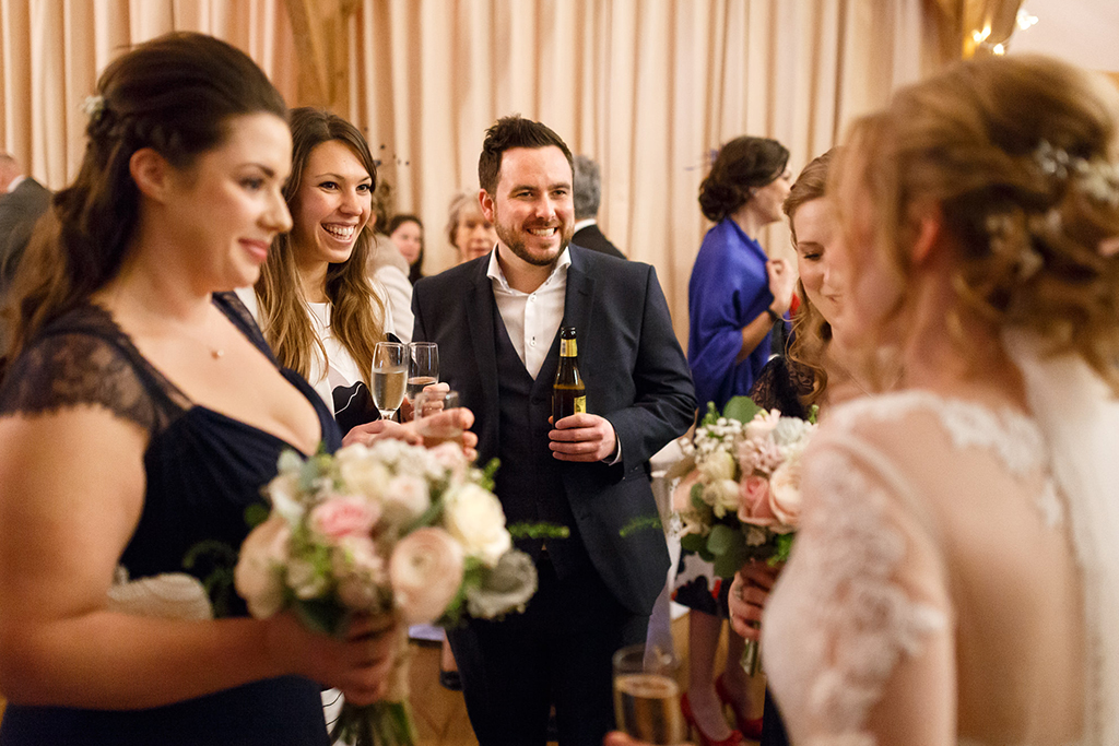 The bride and groom enjoying mingling with their guests at their wedding at Sandhole Oak Barn in Cheshire