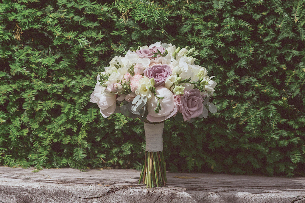 The bride’s wedding bouquet featured beautiful wedding flowers including pink roses and peonies