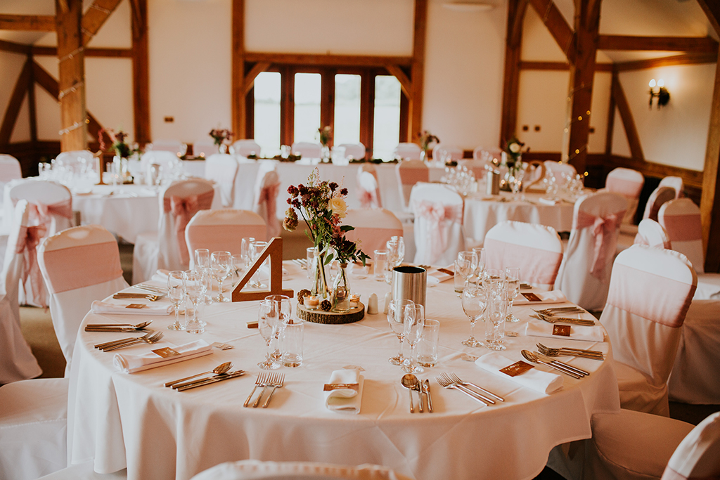The oak barn with views over the lake and beyond looked beautiful set up for the wedding breakfast